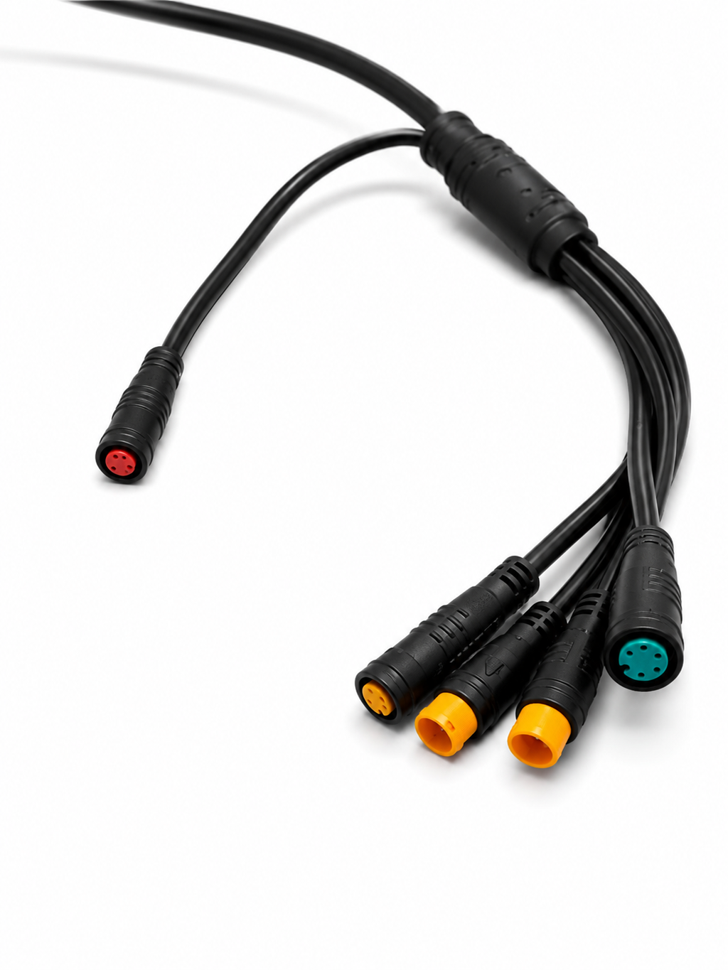 Close-up of an e-bike wiring harness with red, yellow and green color-coded connectors.