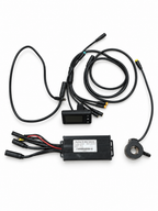 E-bike upgrade components laid out with controller, LCD display, thumb throttle and wiring cables.